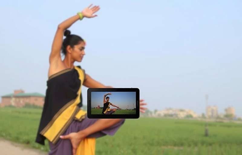 Experienced Yoga Yen Yielders player in Chennai demonstrating proper form for Natarajasana (Dancer's pose) with a smartphone showing the game's feedback